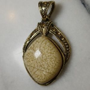 Beuge and bronze colored pendent with stone accent